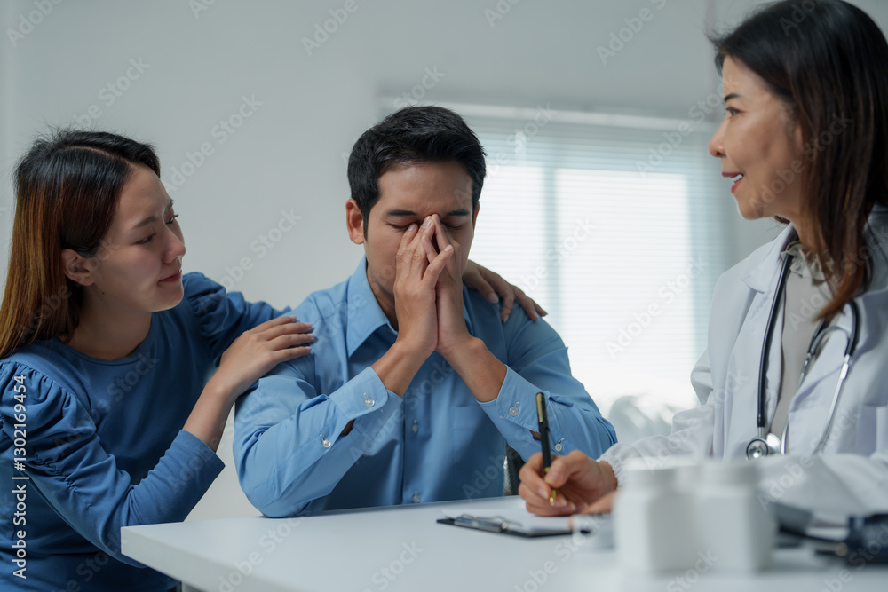 Doctor comforting desperate patient with wife at hospital Doctor comforting desperate patient with wife at hospital