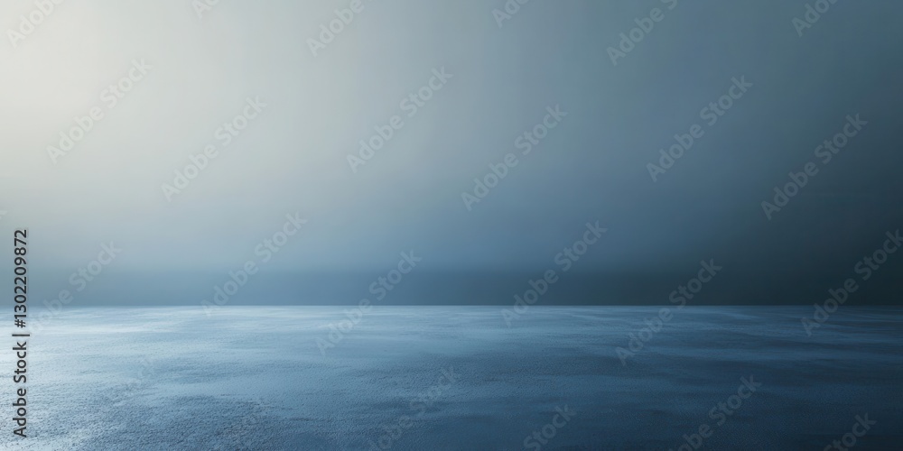 Fototapeta premium A gradient blue backdrop showcases a textured concrete floor