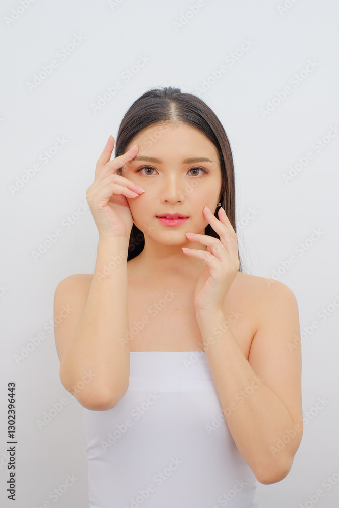 Elegant Asian Lady in White Dress Pampering Her Skin. Ideal for Skincare Ads, Beauty Clinics Elegant Asian Lady in White Dress Pampering Her Skin. Ideal for Skincare Ads, Beauty Clinics