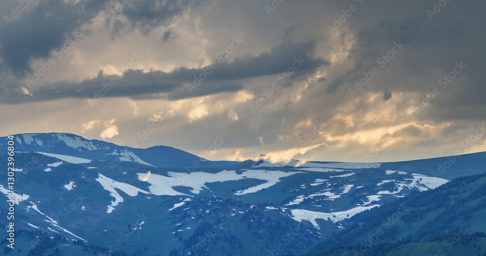 Snow-capped mountain peaks, evening frowning sky Snow-capped mountain peaks, evening frowning sky