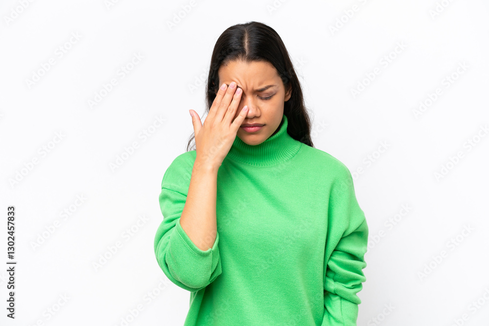 Young Colombian woman isolated on white background with headache Young Colombian woman isolated on white background with headache