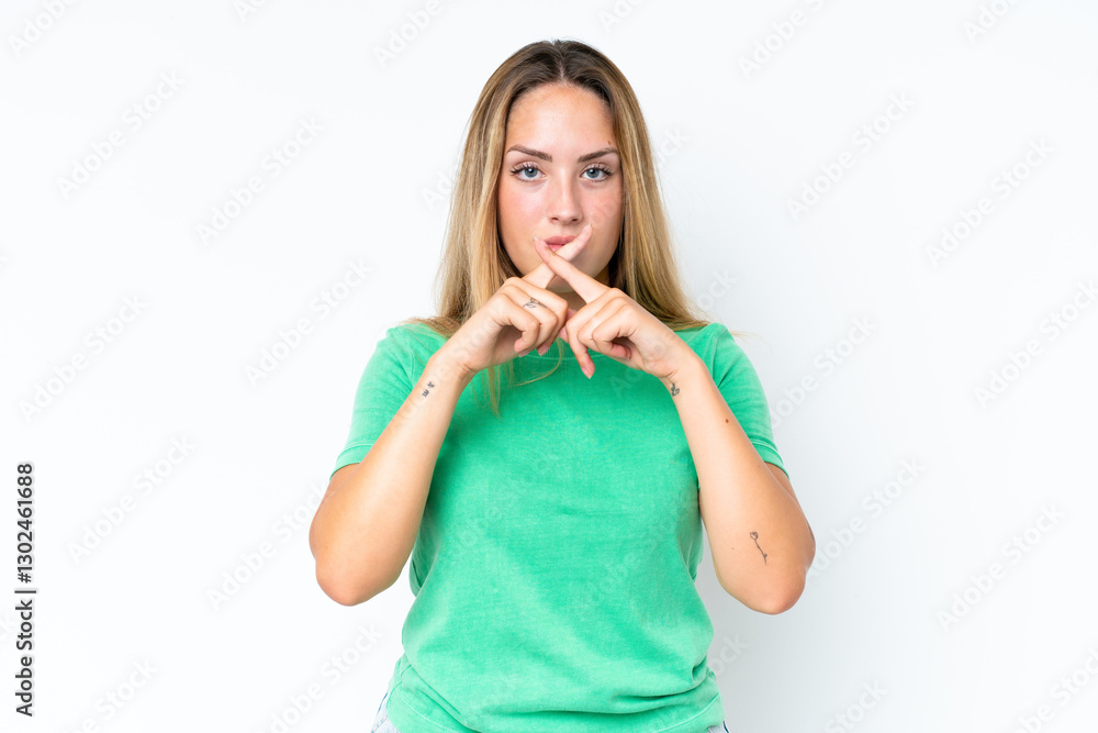 Young caucasian woman isolated on white background showing a sign of silence gesture Young caucasian woman isolated on white background showing a sign of silence gesture