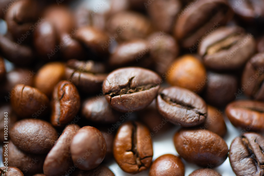 A close-up view of assorted roasted coffee beans, showcasing a rich, deep brown color and unique textures, perfect for coffee lovers. A close-up view of assorted roasted coffee beans, showcasing a rich, deep brown color and unique textures, perfect for coffee lovers.