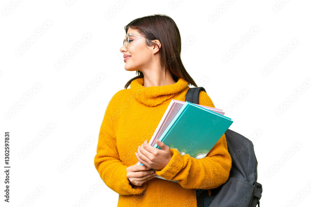 Young student woman over isolated chroma key background looking side Young student woman over isolated chroma key background looking side