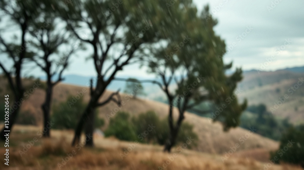 Blurred background of trees and golden hills, creating a serene and natural scene. Blurred background of trees and golden hills, creating a serene and natural scene.