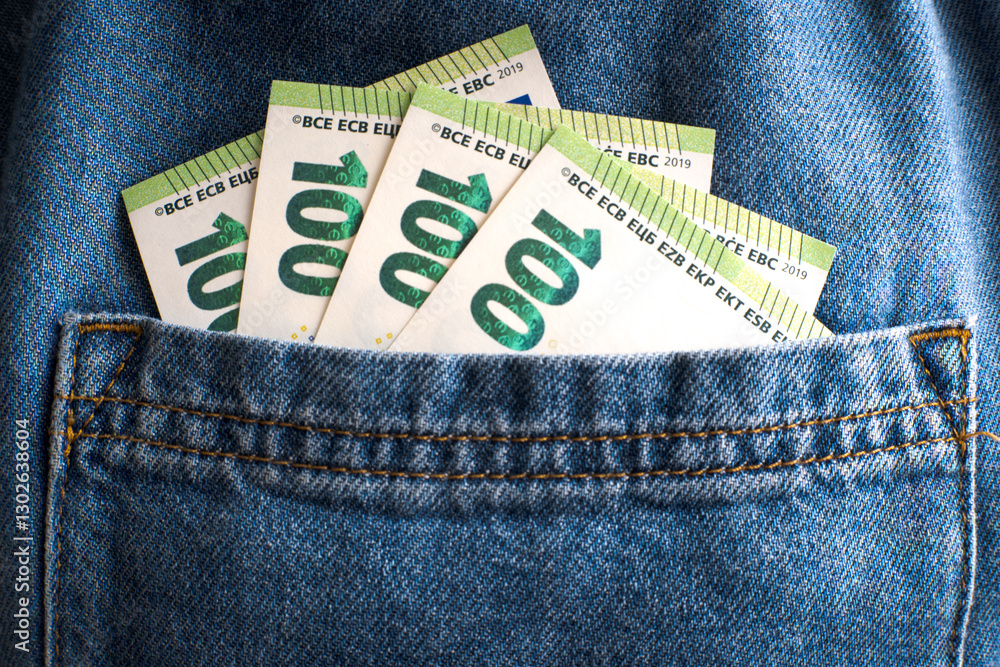 Euro banknotes in trouser pocket.