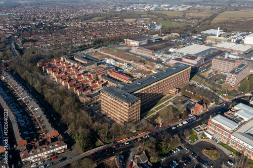 Obraz na płótnie Aerial drone photo of the city of York in North Yorkshire, England showing the large Nestle chocolate factory in the city showing the large building surrounded by houses and homes in the winter time w salonie