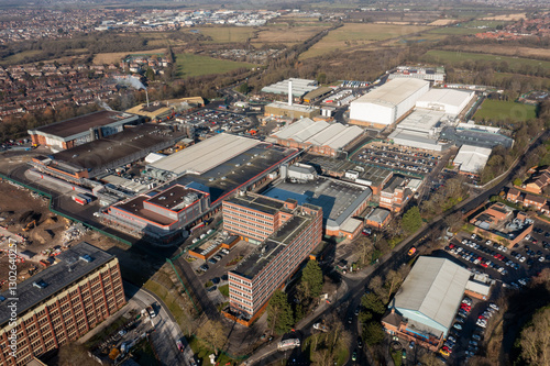Obraz na płótnie Aerial drone photo of the city of York in North Yorkshire, England showing the large Nestle chocolate factory in the city showing the large building surrounded by houses and homes in the winter time w salonie