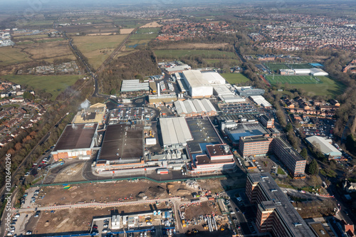 Obraz na płótnie Aerial drone photo of the city of York in North Yorkshire, England showing the large Nestle chocolate factory in the city showing the large building surrounded by houses and homes in the winter time w salonie