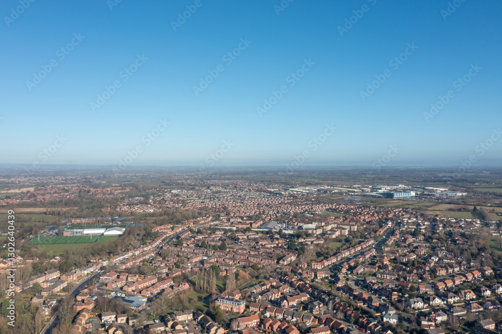 Aerial drone photo of the city of York in North Yorkshire England showing a birds eye view of the British town and rows of houses and large suburban housing estates taken in the winter time