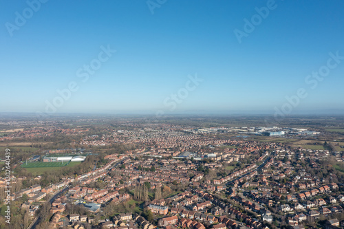 Obraz na płótnie Aerial drone photo of the city of York in North Yorkshire England showing a birds eye view of the British town and rows of houses and large suburban housing estates taken in the winter time w salonie