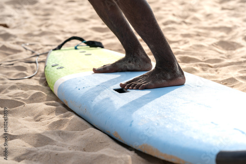 Photography An example position of Asian professional feet on a surfboard in surfing board lesson study and training by the teacher
