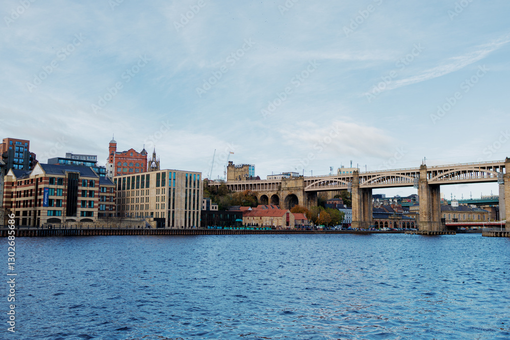 Newcastle UK:29th Oct 2024. River Tyne famous bridges on sunny winter afternoon during golden hour. High Level Bridge. Autumn colours enhance the scenery