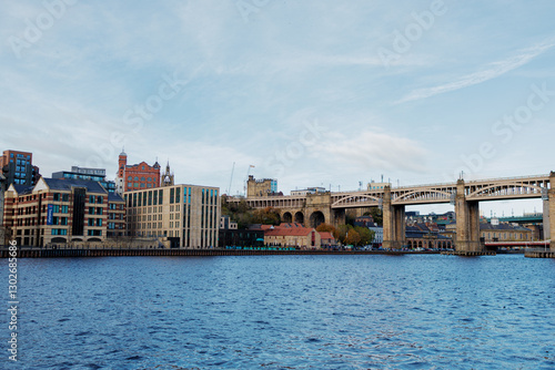 Obraz na płótnie Newcastle UK:29th Oct 2024. River Tyne famous bridges on sunny winter afternoon during golden hour. High Level Bridge. Autumn colours enhance the scenery w salonie