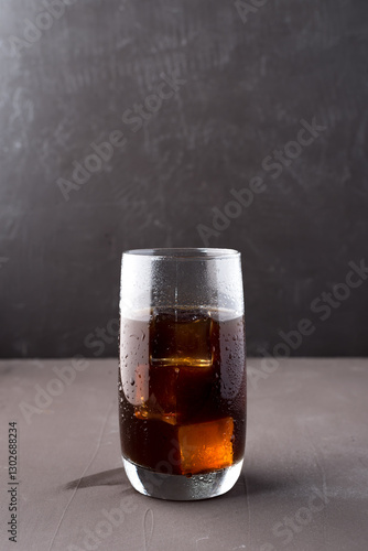 Cold iced coffee in a clear cup.