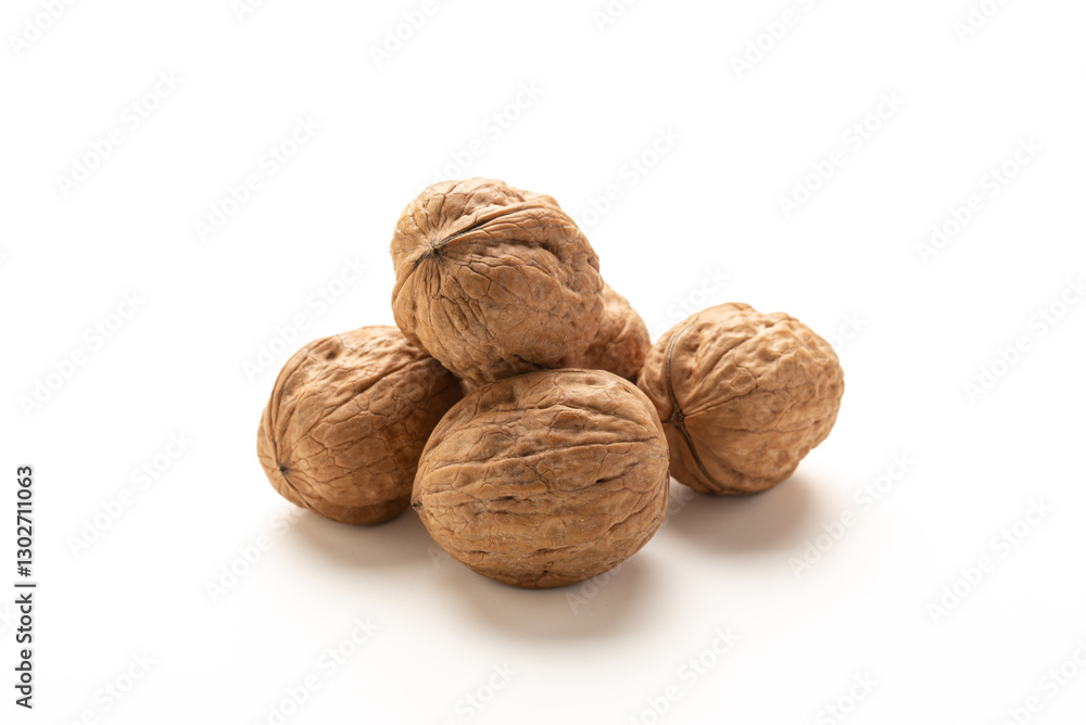 Heap of walnuts fruits on white background Heap of walnuts fruits on white background