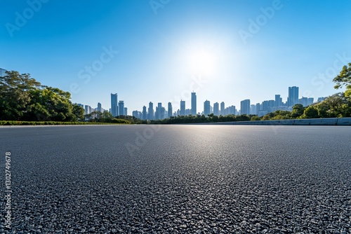 Fototapeta Naklejka Na Ścianę i Meble -  Empty asphalt road leading to city skyline
