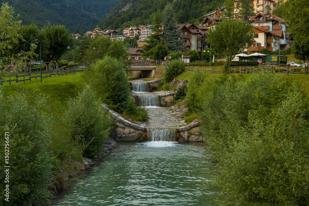 Obraz premium Beautiful traditional summer view in Molveno, Trentino Alto Adige, Italy, scenic village, lake, and mountain landscape