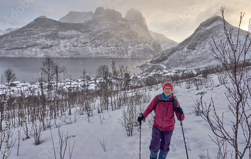 Woman hike in winter up to ...