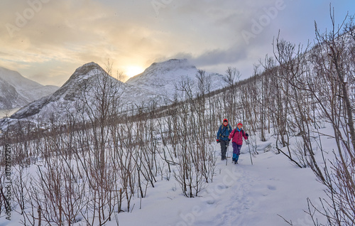 couple hiking in winter up ...