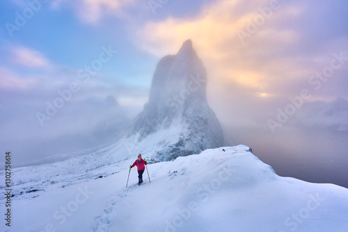 Woman  hiking in winter up ...