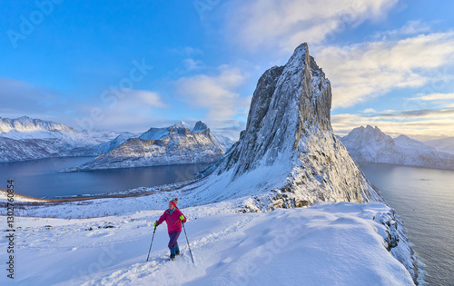 Woman  hiking in winter up ...