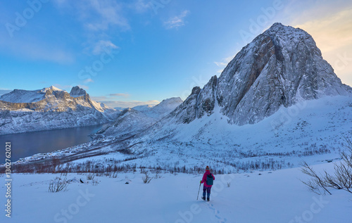 Woman  hiking in winter up ...