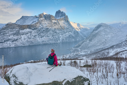 Woman hike in winter up to ...