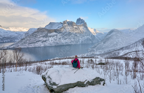 Woman hike in winter up to ...