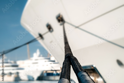Fotografie Detail shot of mooring line at the bow of a superyacht