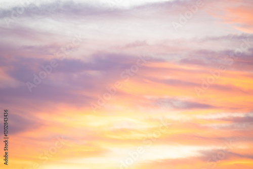 A beautiful orange and pink sky with clouds