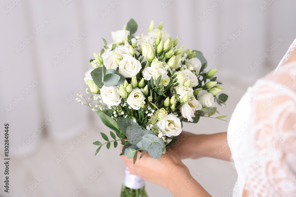 Bride with beautiful wedding bouquet on light background, closeup. Space for text Bride with beautiful wedding bouquet on light background, closeup. Space for text