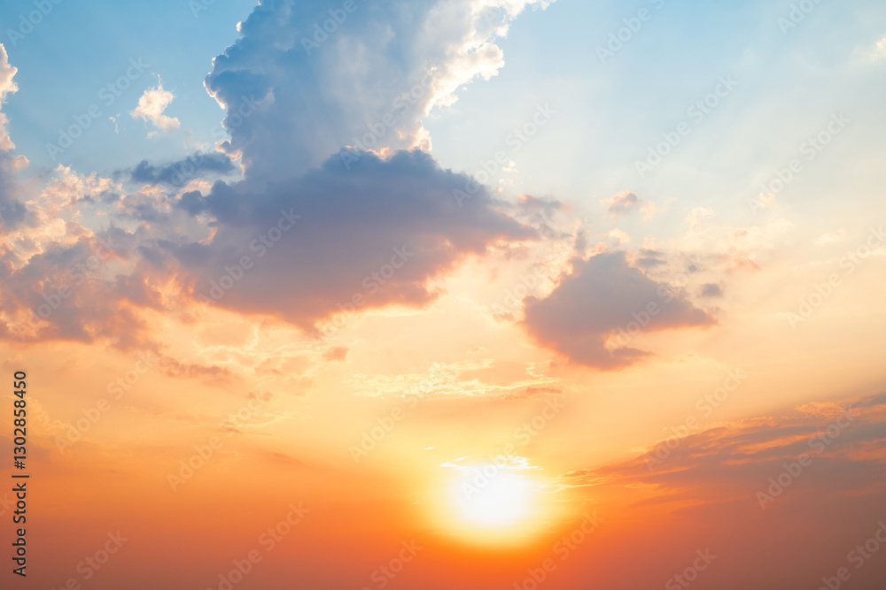 Fototapeta premium Sky,sunset, beautiful , luxury soft gradient orange gold clouds and sunlight on the blue sky perfect for the background, Sunrise on morning or evening in winter warm time ,Twilight summer,silhouette