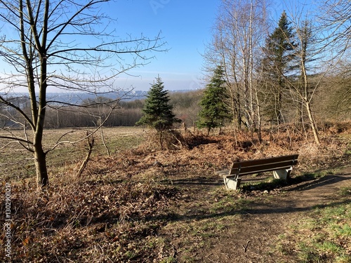 Bank in reizvoller Naturlandschaft im Frühling mit Blick Richtung Solingen in bergischen Land photo