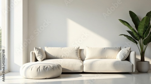 Modern minimalist living room with sunlight illuminating a cream-colored sectional sofa and a round ottoman, complemented by a large potted plant