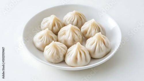 Plate of Steamed Soup Dumplings / 皿に盛られた小籠包