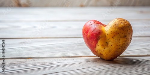 Ugly Heart-Shaped Potato Close-Up on White Wooden Table - Funny Food Photography