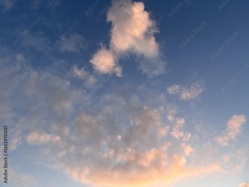 Fototapeta premium natural background, blue sky, thick clouds, beautiful natural gradations of the golden hour