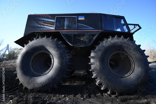 Obraz na plátne An unusual amphibious vehicle features huge tires, designed for rugged terrain