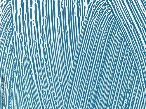 soap foam on window glass, blue background, spring cleaning, abstract pattern
