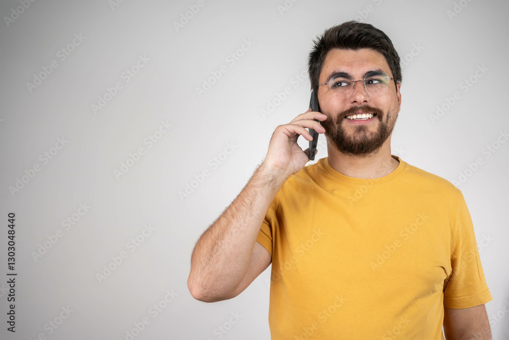 Network, phone call and man with a smile, conversation and model isolated on a grey background. Internet, cellphone and guy with happiness, communication and contact and connection Network, phone call and man with a smile, conversation and model isolated on a grey background. Internet, cellphone and guy with happiness, communication and contact and connection