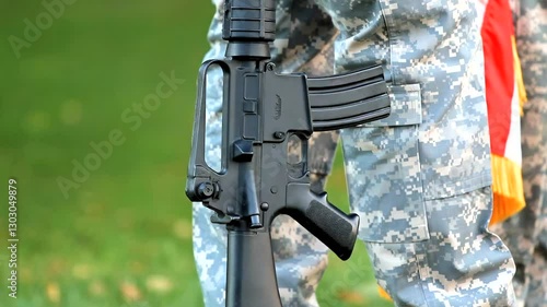 Close Up Of A Military Rifle At Ground Level Held Upright