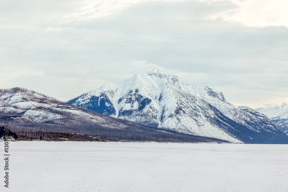 winter scene of snow-covered mountains at Lake McDonald, Glacier National Park, Montana winter scene of snow-covered mountains at Lake McDonald, Glacier National Park, Montana
