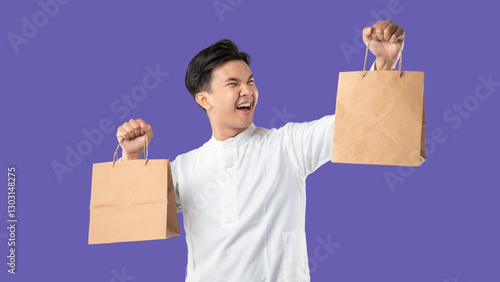 A man holds a brown paper bag and smiles. Ramadan and Eid celebrations on purple background
