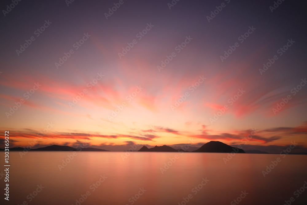 Naklejka premium sunset on the beach. Seaside town of Turgutreis and spectacular sunsets. Selective Focus. Long Exposure shoot. tranquility scene.