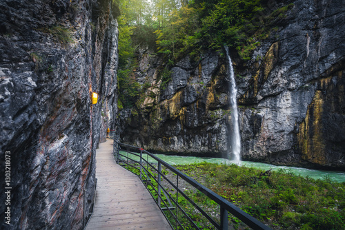 Waterfall and narrow footbridge in the Aare gorge, Meiringen, Switzerland