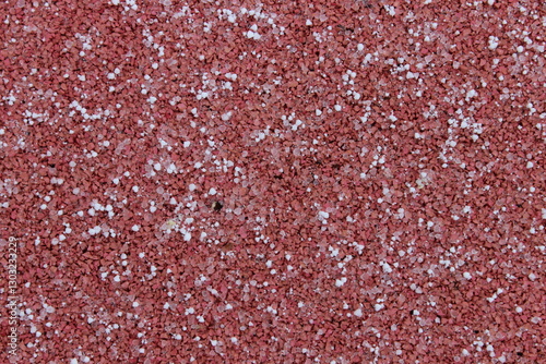 White snowflakes on a red surface. Macro. Russia.