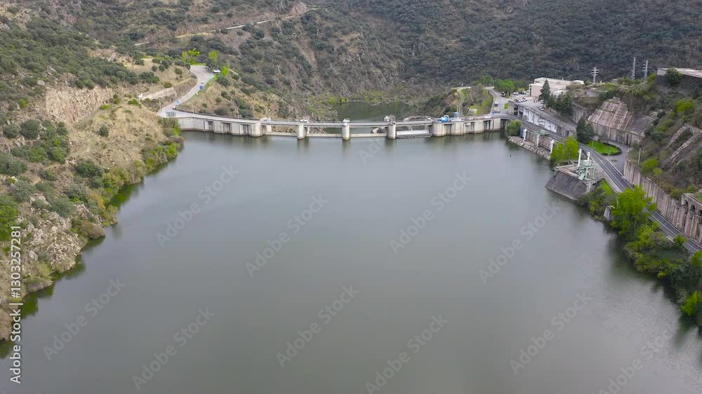 Aerial view of Miranda do Douro reservoir, power station and dam, also known as the Miranda waterfall, are a hydroelectric engineering project located in the section known as Arribes del Duero, Portug Aerial view of Miranda do Douro reservoir, power station and dam, also known as the Miranda waterfall, are a hydroelectric engineering project located in the section known as Arribes del Duero, Portug