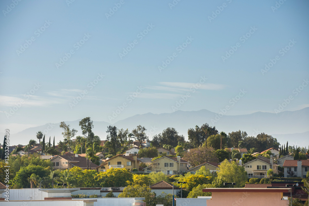 Afternoon light shines on houses in Chino Hills, California, USA. Afternoon light shines on houses in Chino Hills, California, USA.