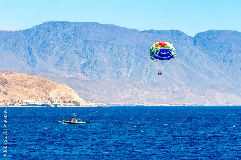 Water sport activities using parachute, flying above the Red Sea, sandy beaches and mountains, Eilat, Israel, Middle East. My own photo. No AI tools were used Water sport activities using parachute, flying above the Red Sea, sandy beaches and mountains, Eilat, Israel, Middle East. My own photo. No AI tools were used